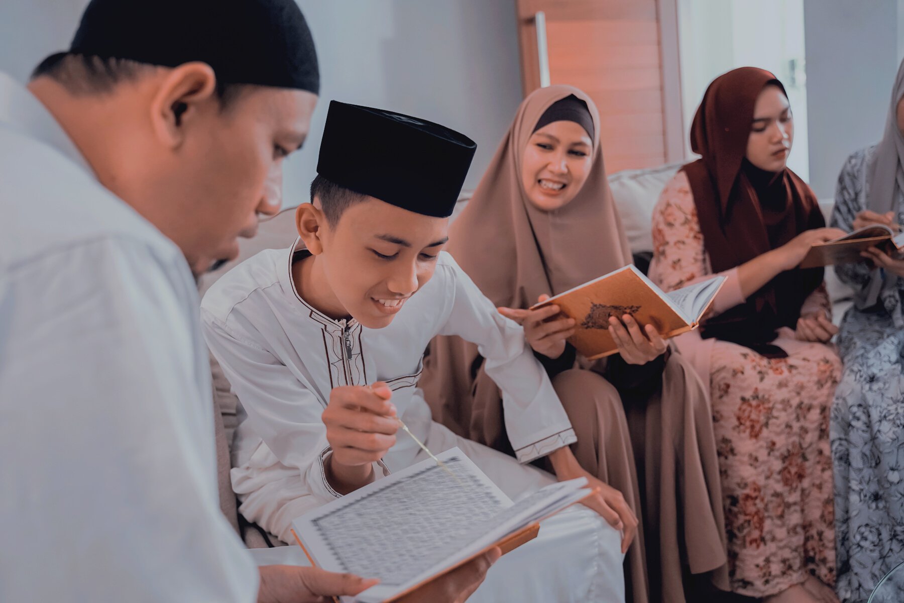 Muslim Family Reading Quran Together